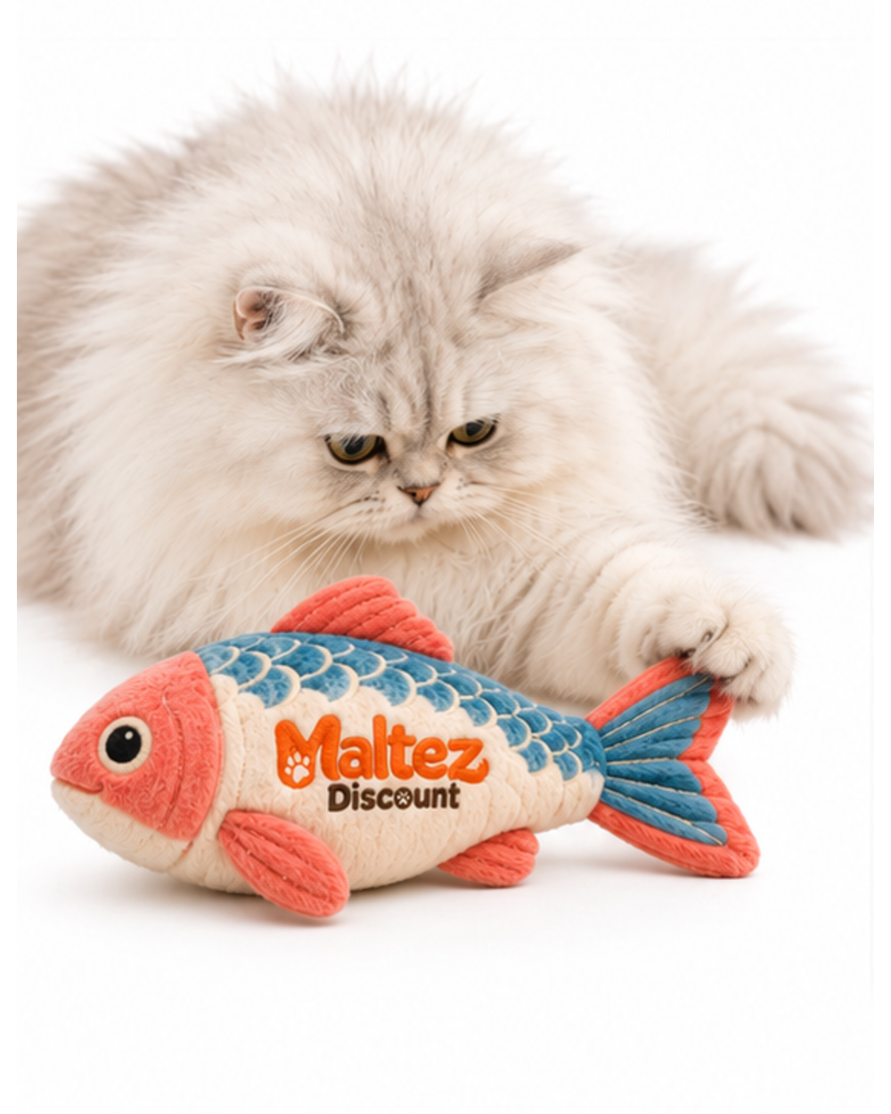 White long-haired cat lying beside the plush catnip fish